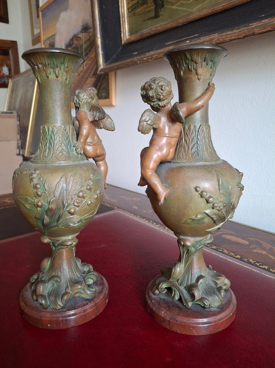 Image 1 of Pair of Art Nouveau spelter vases, circa 1900, with cherubs and a double patina