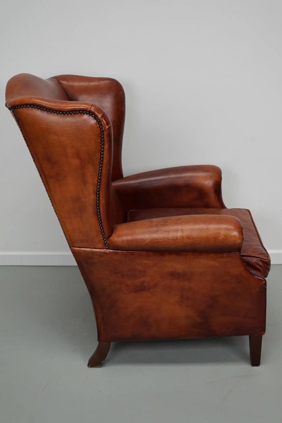Image 1 of Vintage Nederlandse cognackleurige leren clubfauteuil met vleugelrug