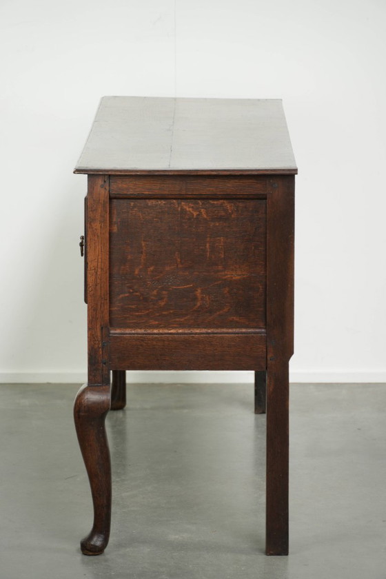 Image 1 of Beautifully sized antique 18th-century English oak dresser/sideboard with brass handles and beautiful colors.