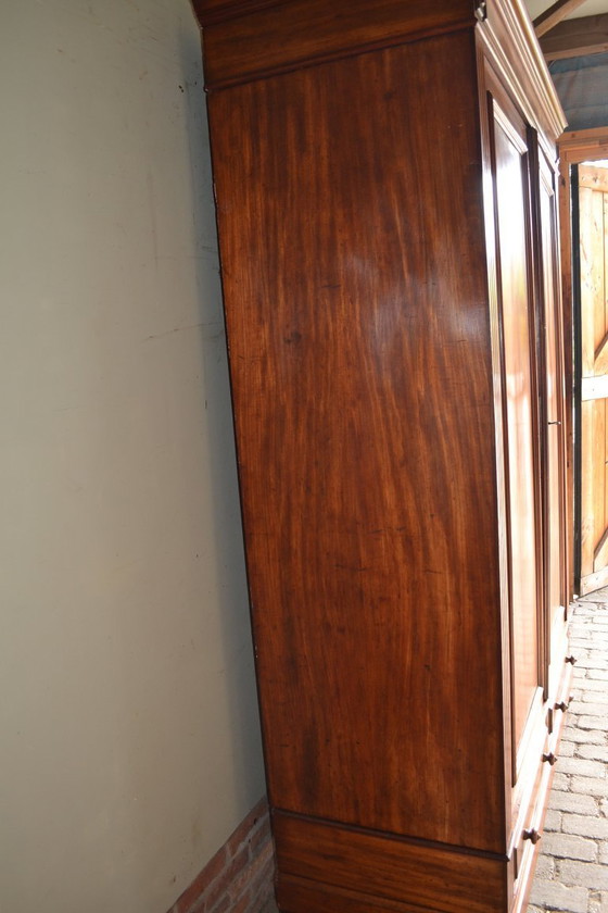 Image 1 of Sleek antique mahogany cabinet.