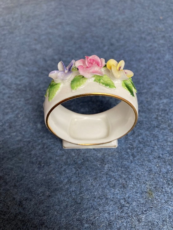 Image 1 of Porcelain napkin ring with applied flowers
