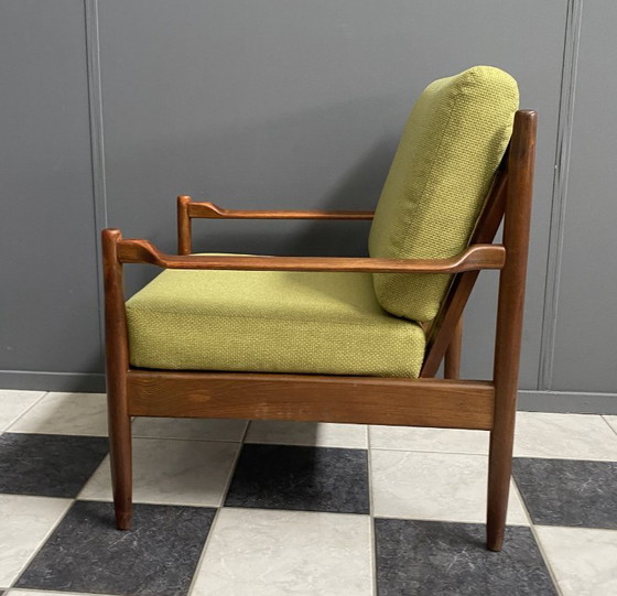 Image 1 of Gele stoffen en houten relaxstoel uit de jaren 60.