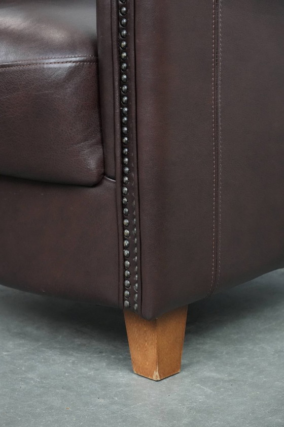 Image 1 of Cowhide club armchair, in very good condition, English style in a brown/dark purple color scheme