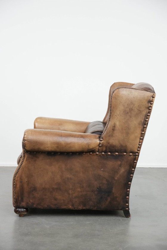 Image 1 of Ohrensessel im englischen Stil aus Kuhfell