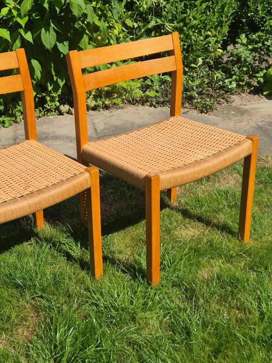 Image 1 of 4 Stuks J.L. Møller Model 401 eikenhouten eetkamerstoelen met papercord zitting