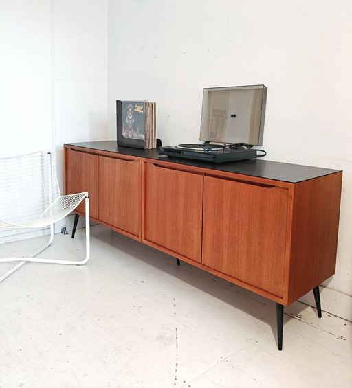 Vintage sideboard with sleek black legs and top plate