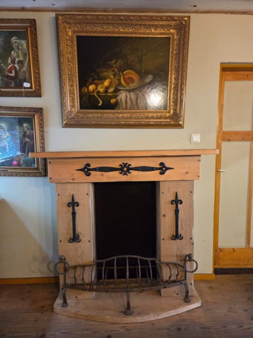 Rural decorative fireplace with wrought iron firebox