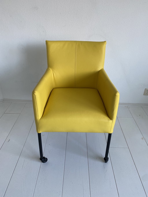 Luxurious yellow leather dining chairs with wheels