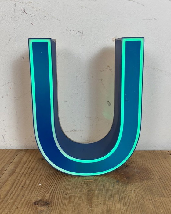 Image 1 of Industrial dark blue enamel factory pendant light made in United Kingdom during the 1950s. White enamel inside the shade. Brass 