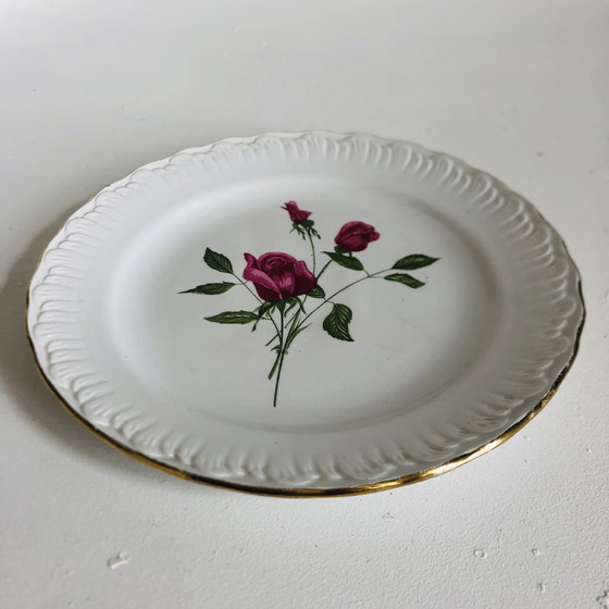 Image 1 of Steingutteller von L'Amandinoise mit einem floralen Art-Deco-Motiv