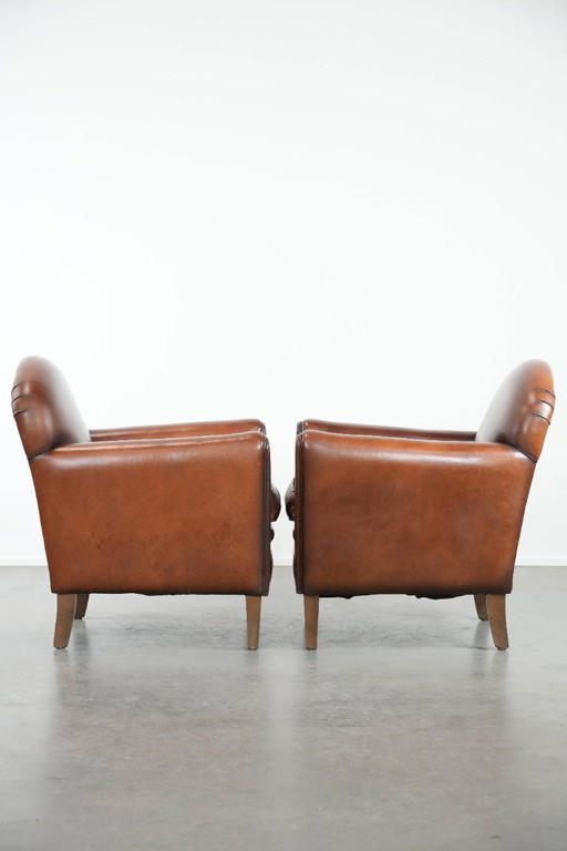 2 x Beautifully shaped sheepskin Art Deco design armchairs