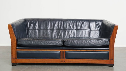 2x 2.5-seater Schuitema Art Deco design sofa with woodwork and dark blue cowhide leather