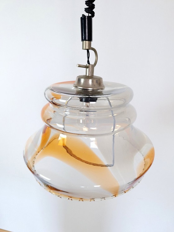 Image 1 of Vintage 1970s Yugoslavian Pendant Light / Mid-Century Glass Ceiling Lamp / Retro Amber Swirl Hanging Light