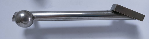 three art deco silver-tone cover handles