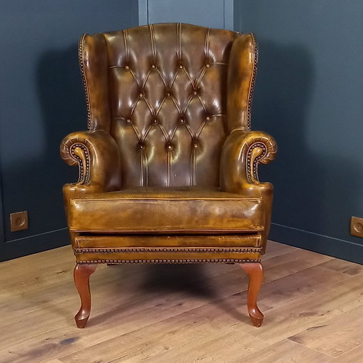 Cognac colored Vintage chesterfield armchair. 2 of 2