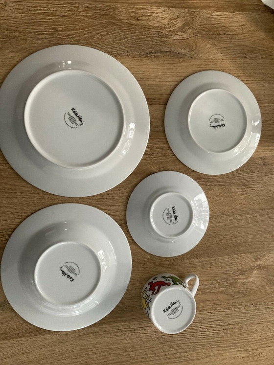 Image 1 of Keith Haring Dinnerware: 3 different sized plates, 1 coffee cup and saucer.