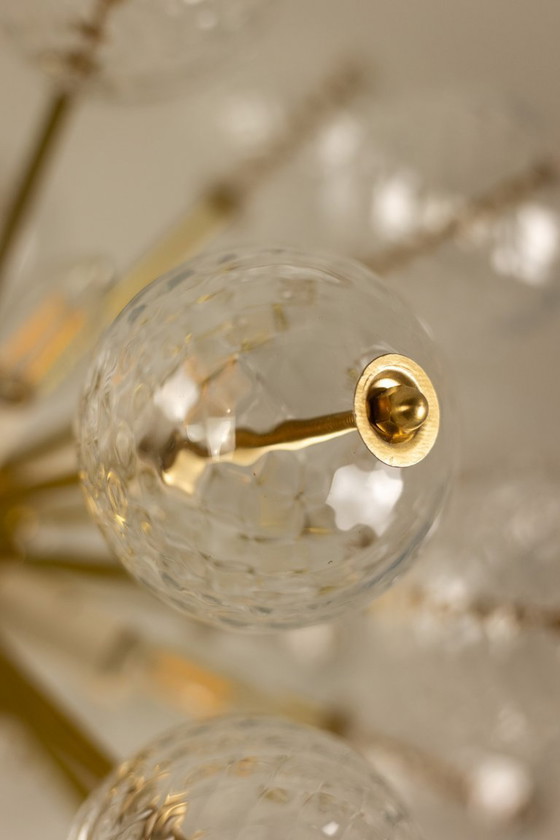 Image 1 of Kamenicky Senov, editor. Pair of brass and glass chandeliers. Circa 1970