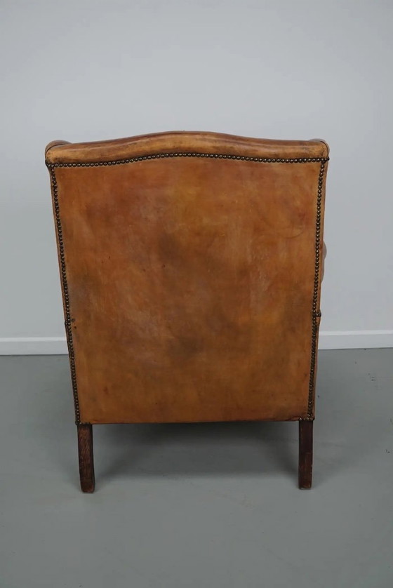 Image 1 of Vintage Nederlandse cognackleurige leren clubfauteuil met voetenbank