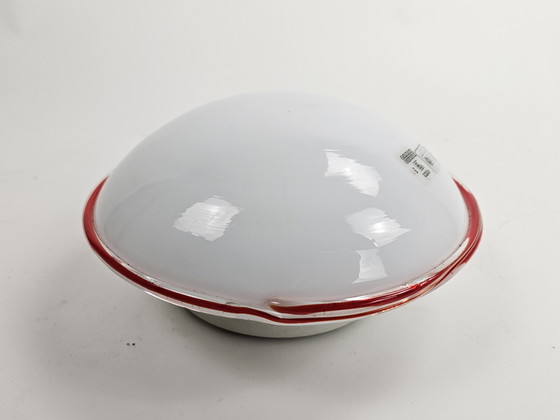 Image 1 of Ceiling or wall lamp by Leucos Italian milk glass discus model with red rim