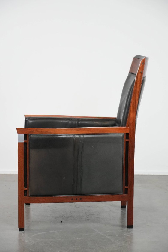 Image 1 of Black cowhide and wooden Art Deco design armchair by Schuitema from the Decoforma series with decorative cushion