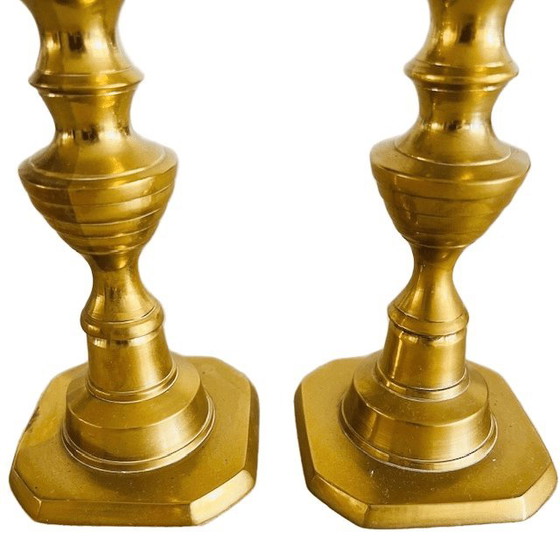 Image 1 of Set of antique English brass pusher candlesticks from the 1890s