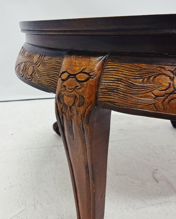 Image 1 of Round Wooden Coffee Table with Asian Carved Top