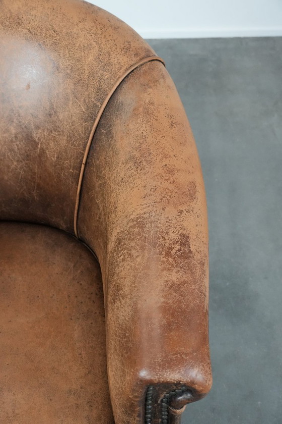 Image 1 of Timeless vintage sheepskin club armchair with character and a beautiful patina