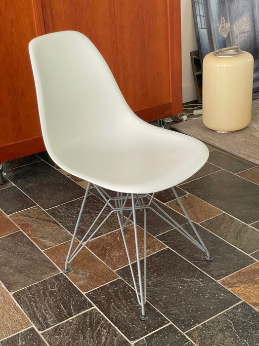Two designer chairs (Vitra and Kartell), white
