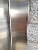 Stainless steel bookcase with glass shelves
