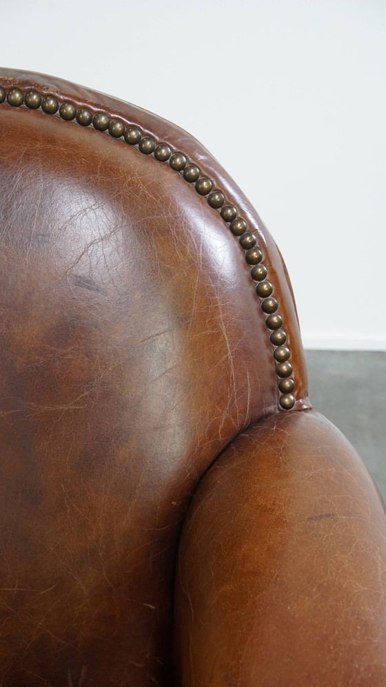 Image 1 of Rundleren design fauteuil/ armchair met ronde vormen en siernagels