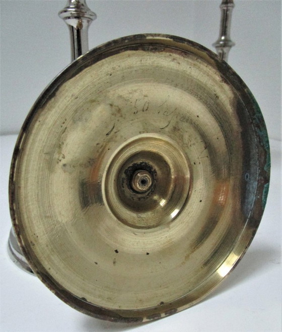Image 1 of three early 20th-century chrome and brass candlesticks
