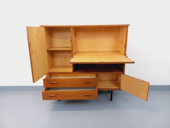 Image 1 of Vintage Scandinavisch modernistisch secretair bureau/boekenkast van teakhout en zwart metaal uit de jaren 50/60.