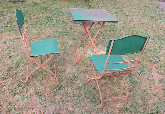 Image 1 of Table de jardin et 2 chaises en fer peint vieilli, style années 1960