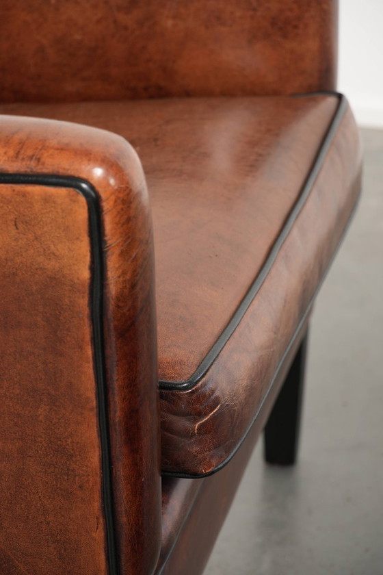2 fauteuils en peau de mouton au design unique, avec passepoil noir et couleurs profondes. – Leather (photo 20 of 20)
