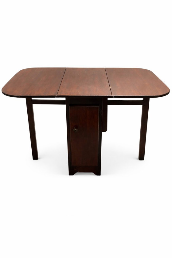 Image 1 of Tavolo pieghevole vintage con ante a ribalta – Legno scuro, circa 1950