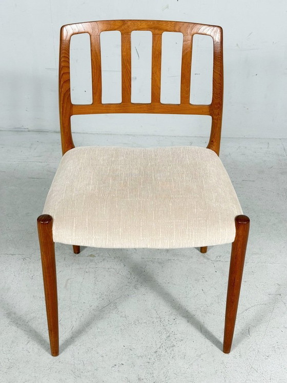 Image 1 of JL Møllers, ensemble de 4 chaises de salle à manger, modèle '83', teck, laine, années 1960, Danemark (4)