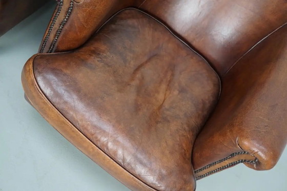 Image 1 of Vintage Nederlandse leren clubfauteuils in cognackleur, set van 2 met voetenbank