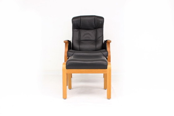 Image 1 of as new, Danish Nordic Easy Lounge Chair / Relax Armchair with stool in oak and leather.