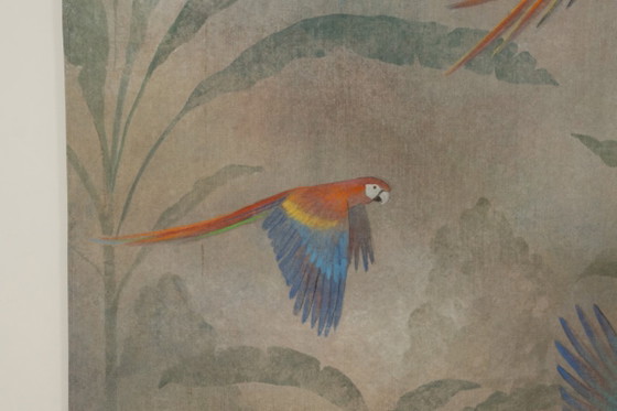 Image 1 of Contemporary painted canvas depicting parrots in a tropical forest.