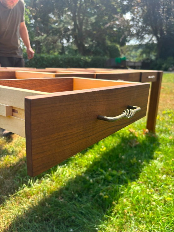 Image 1 of Dining table in American walnut and maple. Handcrafted solid wood extensions and drawers. Live edge for visual depth. Epoxy resi