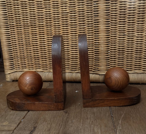 Image 1 of 2x Art Deco bookends. Left the paper in place and don't know if there is anything underneath.