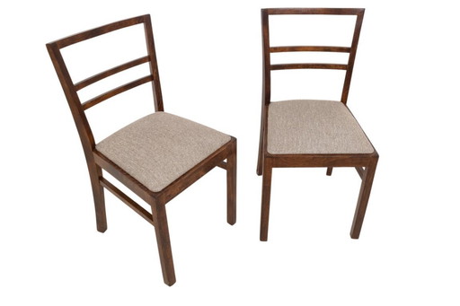 A pair of Art Deco chairs from the mid-20th century.