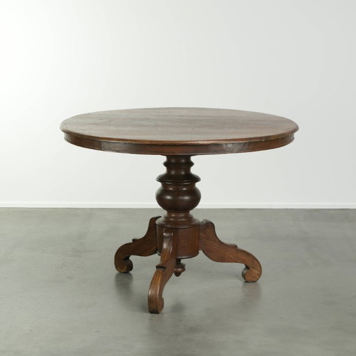 Beautiful subtle round rustic wooden dining table with a lovely appearance and a beautiful patina