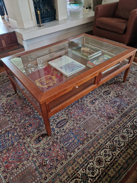 Image 1 of Beautiful cherry wood coffee table with glass top and display shutters