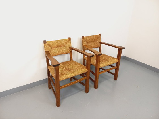 Image 1 of Suite van 2 vintage Brutalistische fauteuils in eiken en stro uit de jaren 60