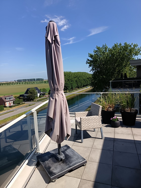 Image 1 of Floating parasol with base