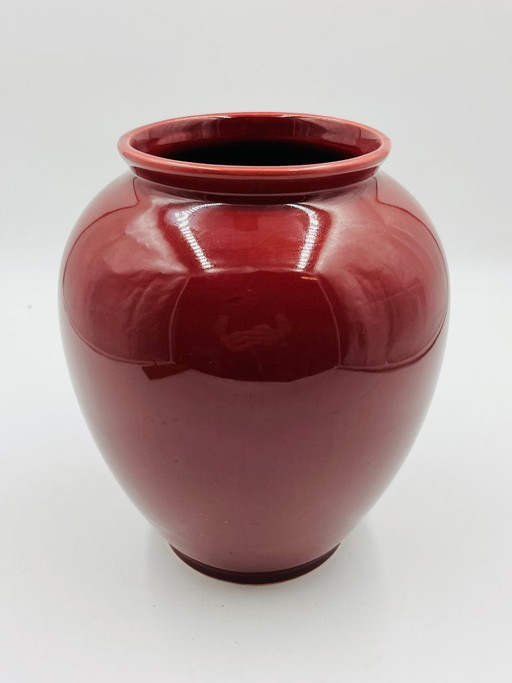 Vintage vase in burgundy red glazed ceramic