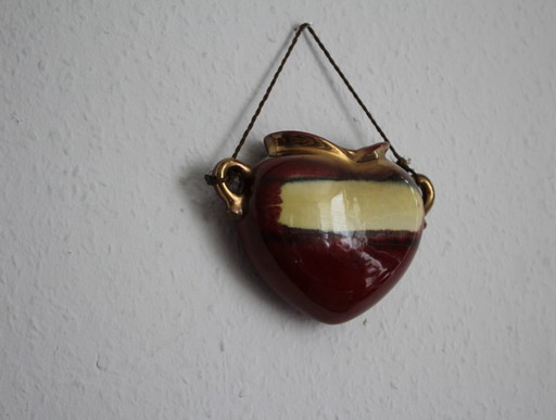 Vintage heart-shaped wall vase in the style of an amphora