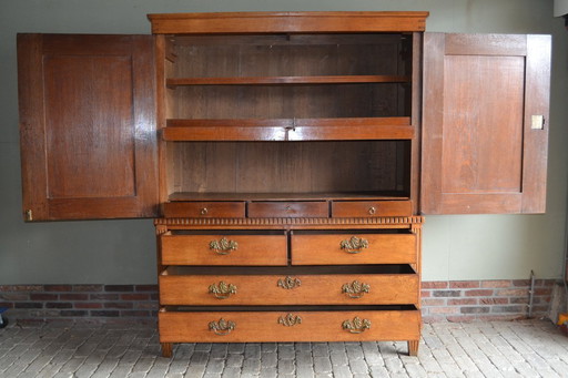 Antique oak wood Empire cabinet.