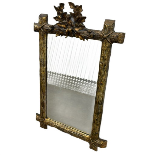 Miroir ancien doré, décor de chérubin et de feuille de chêne